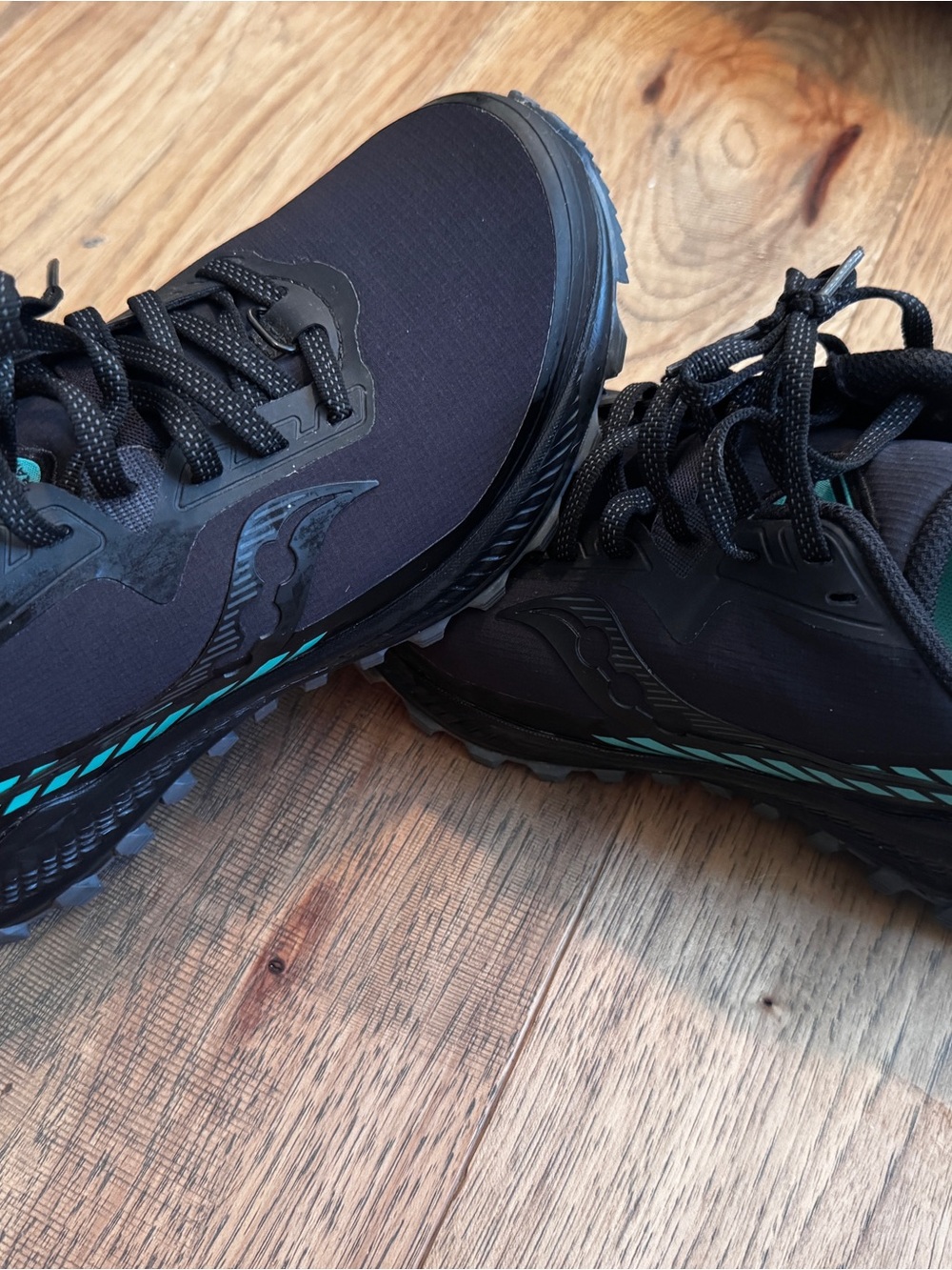 Saucony Women’s Black Trail Runners with Teal Accents
